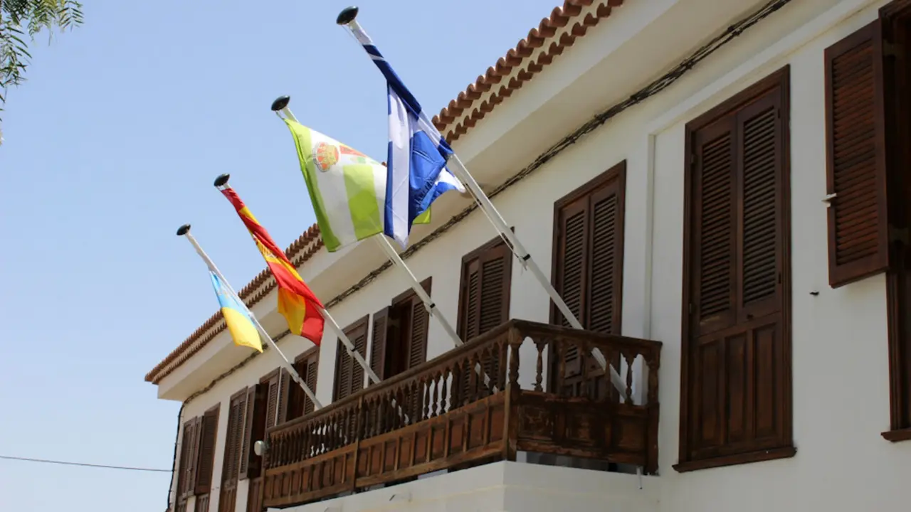 Flags on the Ayuntamiento de Vilaflor - building of Administration of Vilaflor village, Tenerife, Canary Islands, Spain